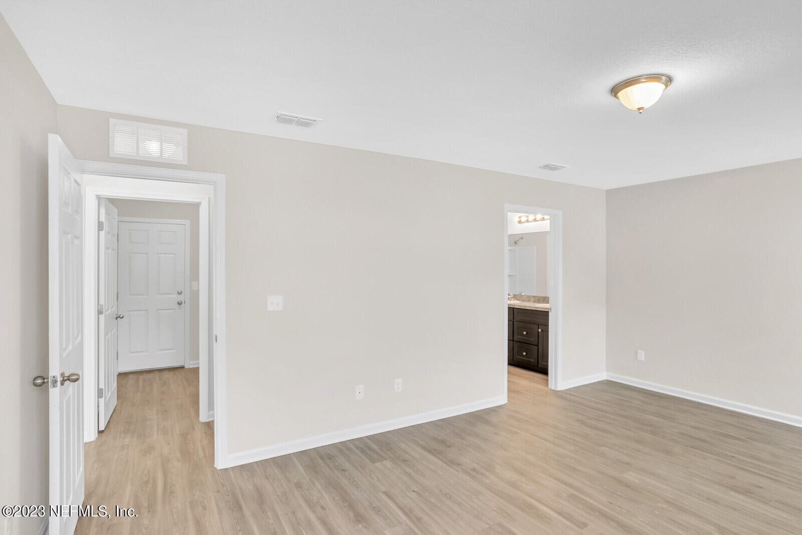 7276 Ridgeway Road North Jacksonville, FL 32244 - Photo 14 of 26 a view of an empty room with wooden floor & closet