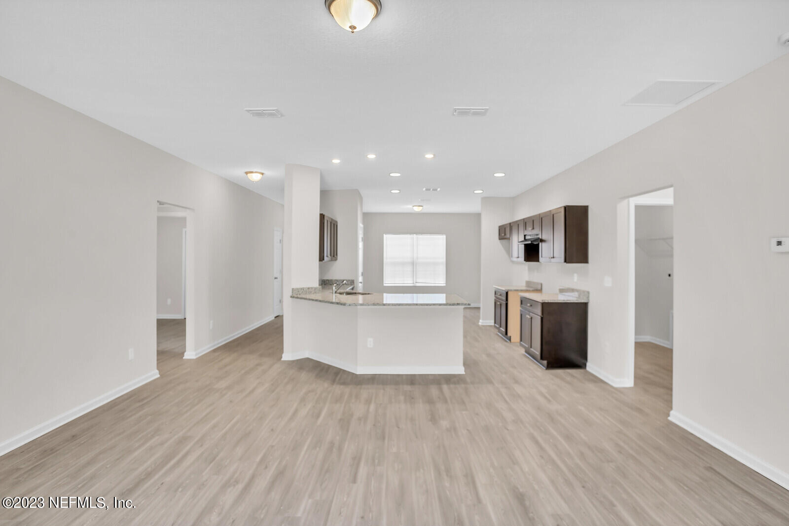 7276 Ridgeway Road North Jacksonville, FL 32244 - Photo 5 of 26 a view of kitchen with stainless steel appliances kitchen island wooden floors and center island