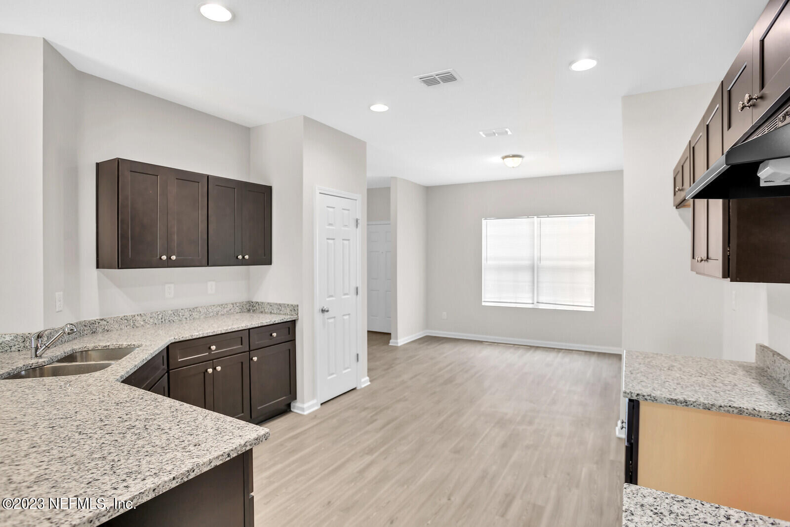 7276 Ridgeway Road North Jacksonville, FL 32244 - Photo 10 of 26 a kitchen with granite countertop a sink a stove and a refrigerator