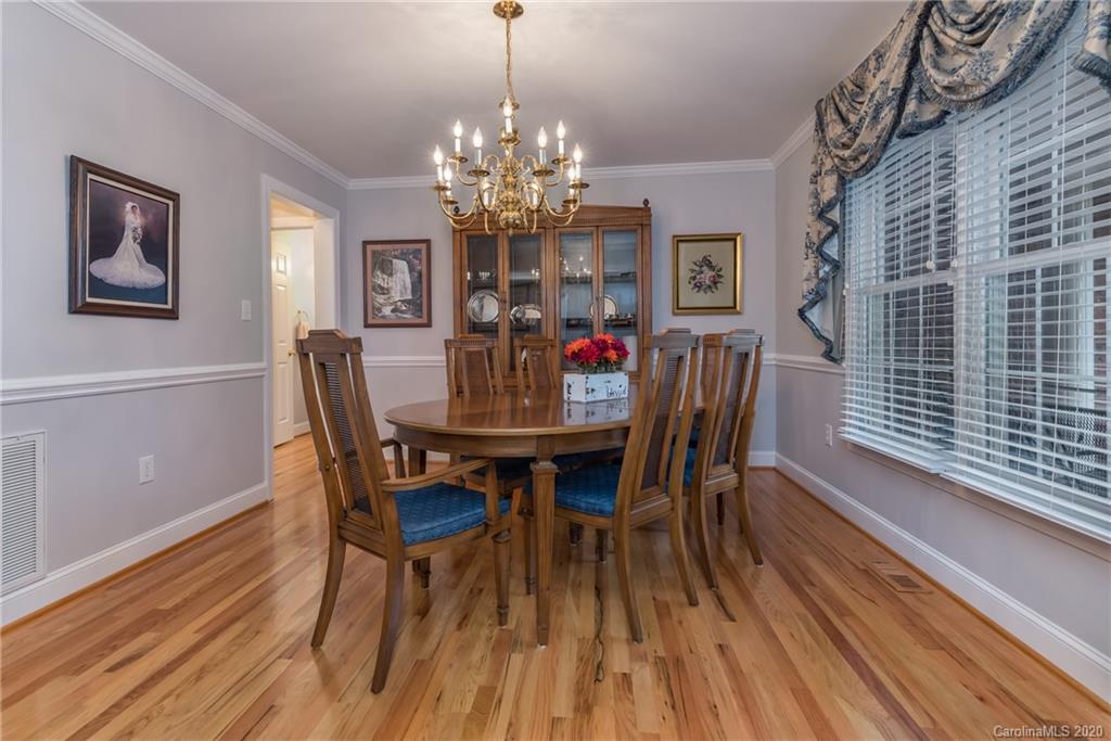 231 Ridgeview Drive Rutherfordton, NC 28139 - Photo 22 of 38 a view of a dining room with furniture a chandelier and wooden floor