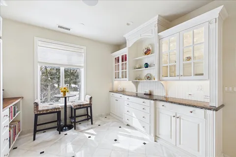 a room that has a dresser and a window in it