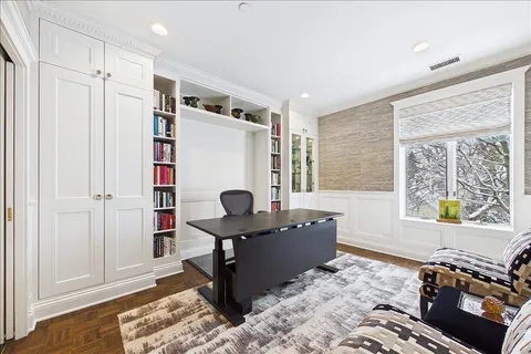 a living room with furniture pool table and a window