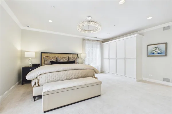 a bedroom with a bed and a view of bathroom