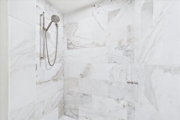 a spacious bedroom with a bed and a couch