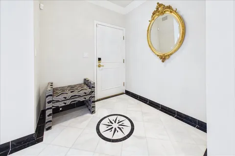 a view of a livingroom with furniture and a mirror