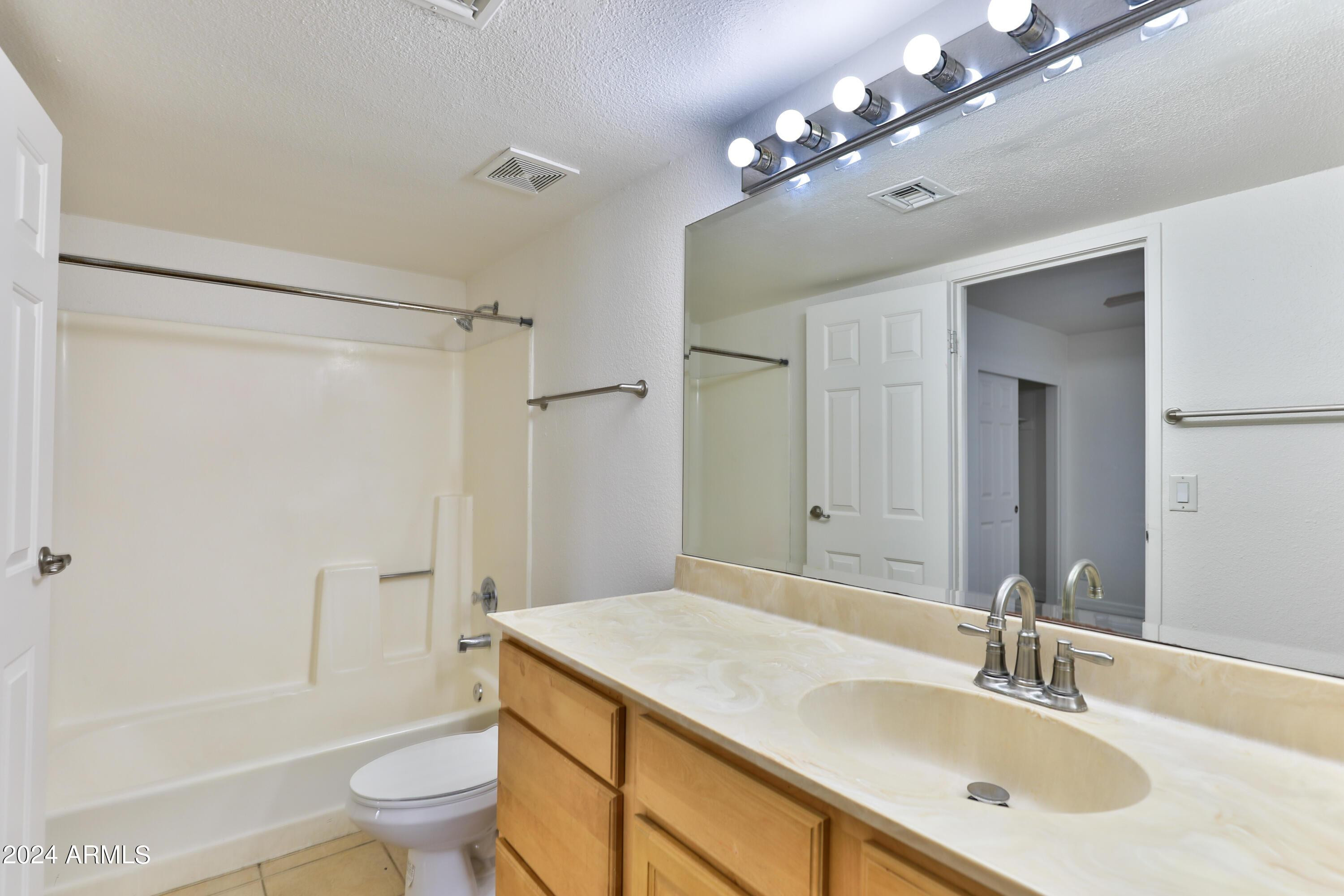 330 South Beck Avenue, Unit 201 Tempe, AZ 85281 - Photo 12 of 17 a bathroom with a sink a toilet and shower