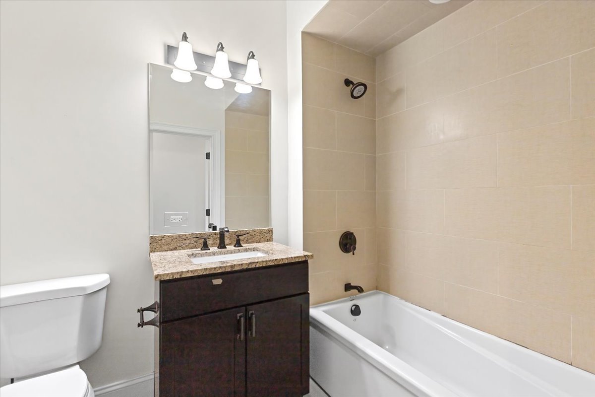 2500 Green Bay Road, Unit 201 Evanston, IL 60201 - Photo 5 of 9 a bathroom with a sink a toilet and shower