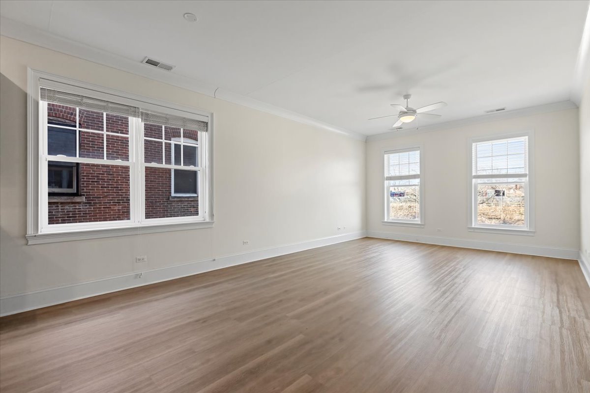 2500 Green Bay Road, Unit 201 Evanston, IL 60201 - Photo 9 of 9 a view of an empty room with a window and wooden floor
