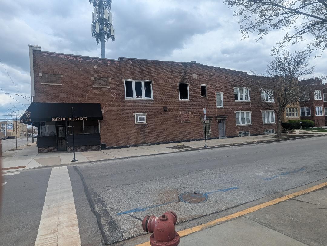 5725 West Division Street Chicago, IL 60651 - Photo 3 of 5 a front view of a house with parking space
