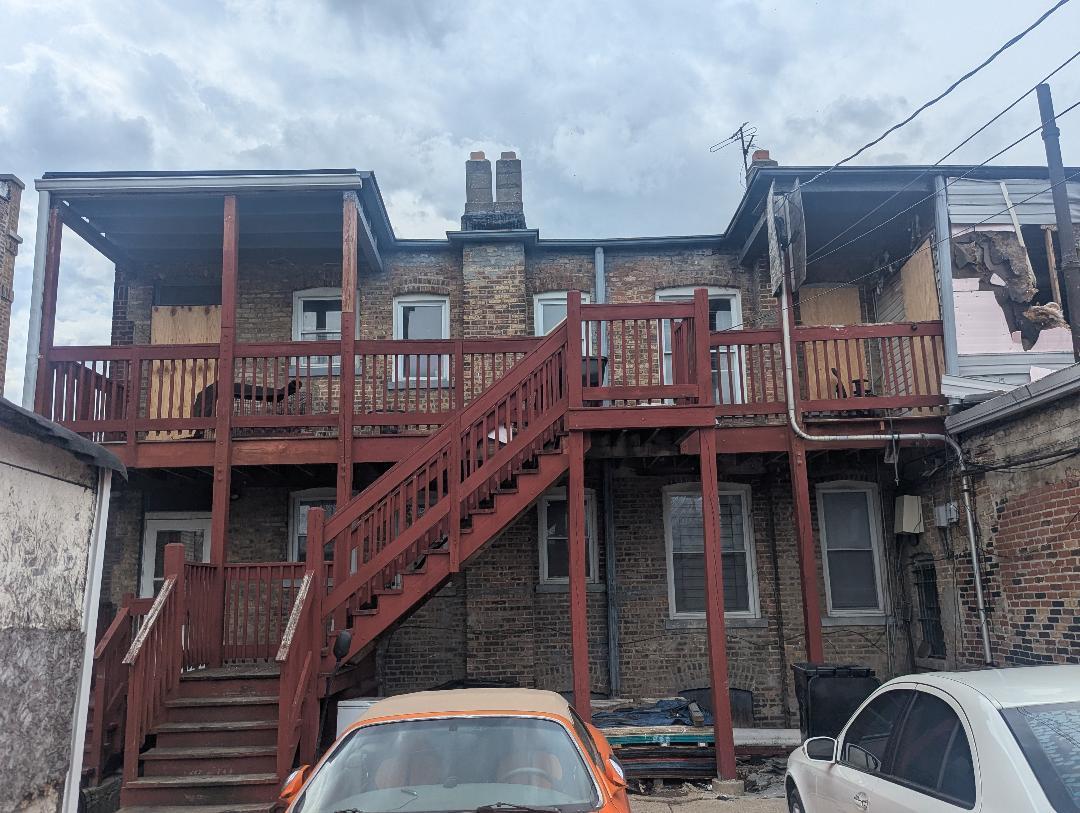 5725 West Division Street Chicago, IL 60651 - Photo 4 of 5 a view of a house with a balcony