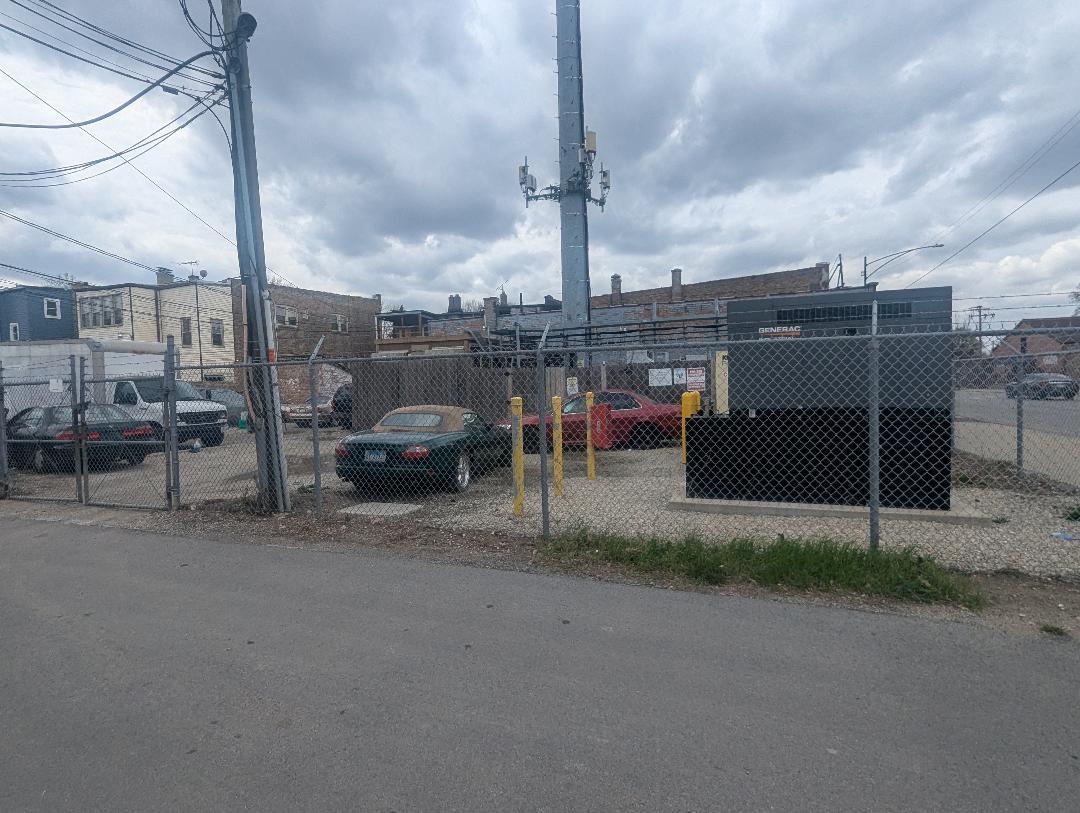 5725 West Division Street Chicago, IL 60651 - Photo 5 of 5 a view of a road with cars