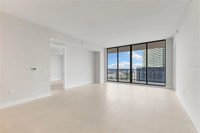 a view of a livingroom with furniture window and wooden floor