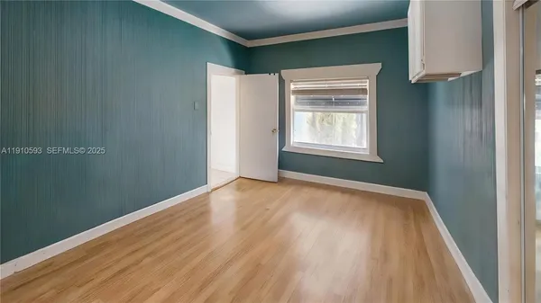 a bedroom with a bed and a shower