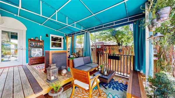 an aerial view of a house with outdoor space