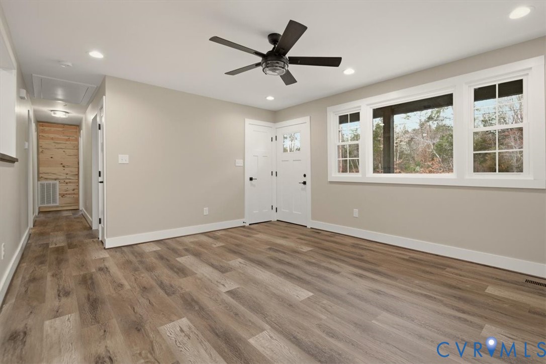 2495 Jackson Shop Road Goochland, VA 23063 - Photo 18 of 38 a view of an empty room with a window and wooden floor