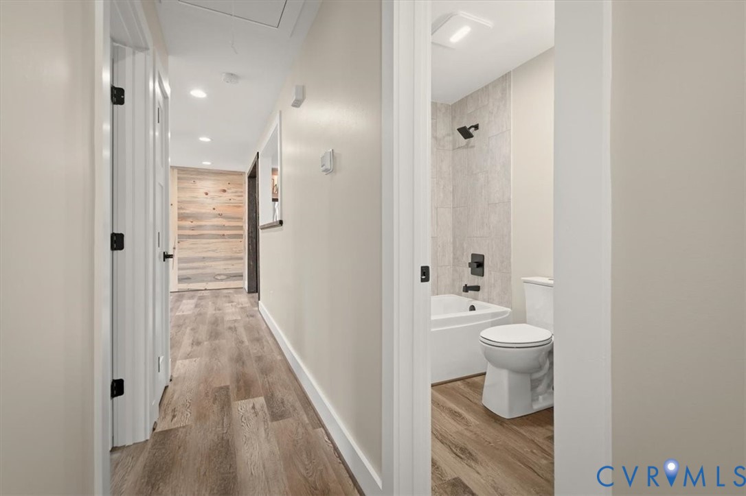 2495 Jackson Shop Road Goochland, VA 23063 - Photo 20 of 38 a bathroom with a toilet sink a mirror and shower