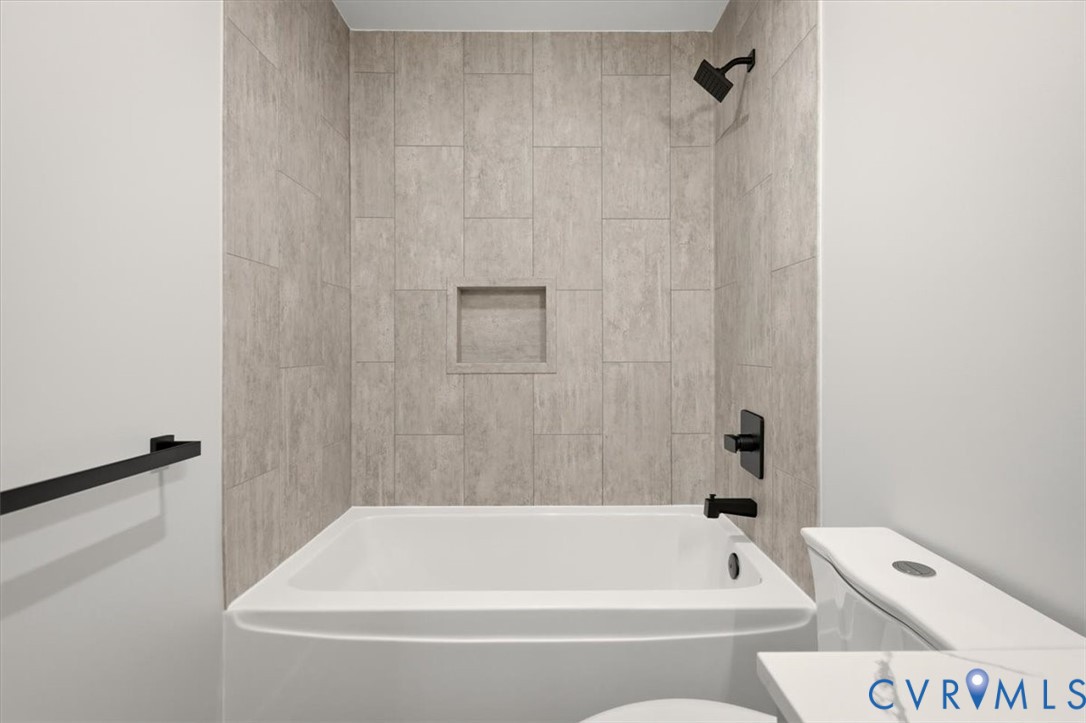 2495 Jackson Shop Road Goochland, VA 23063 - Photo 21 of 38 a bathroom with a bathtub and a shower