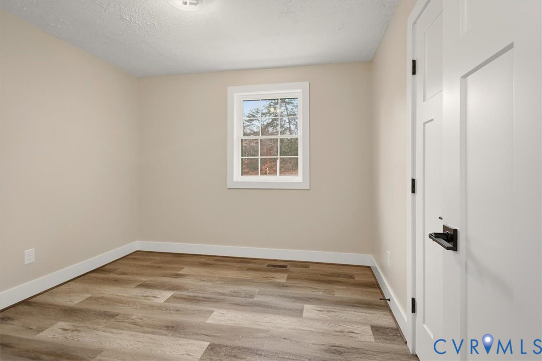 2495 Jackson Shop Road Goochland, VA 23063 - Photo 25 of 38 a view of a room with wooden floor and window