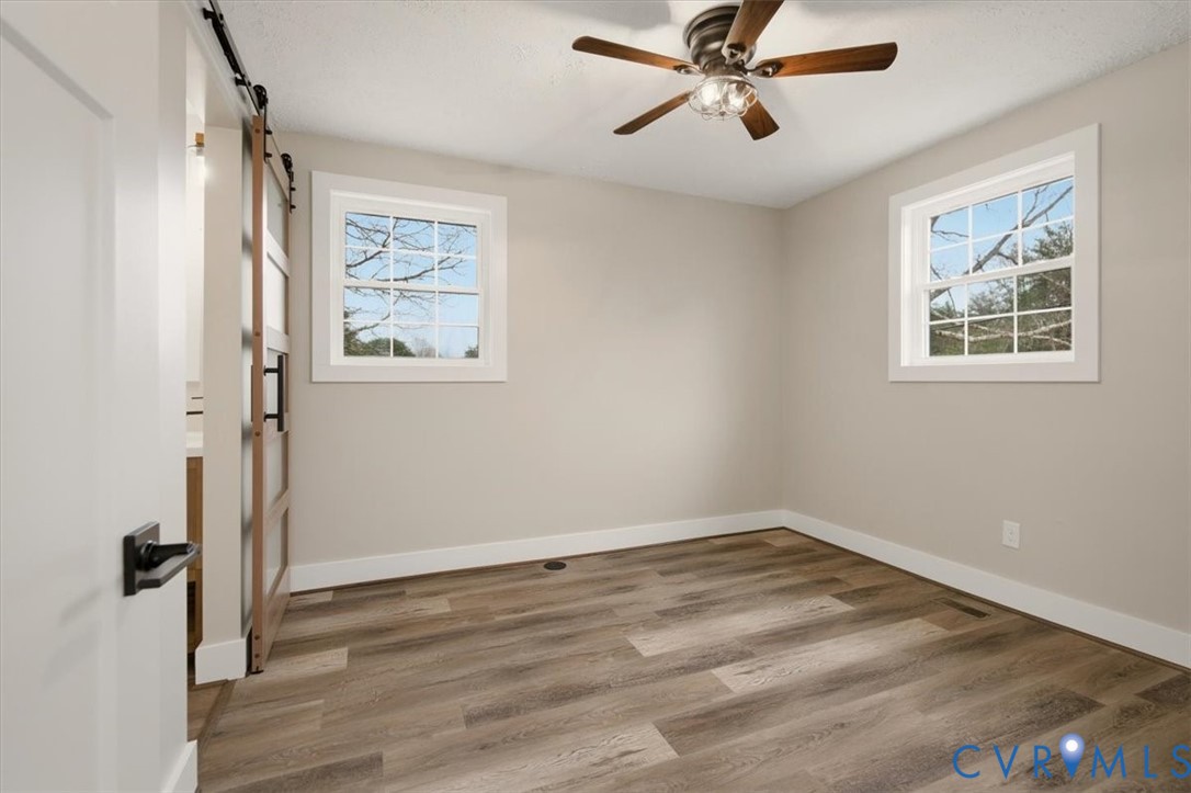 2495 Jackson Shop Road Goochland, VA 23063 - Photo 27 of 38 a view of a room with wooden floor and window