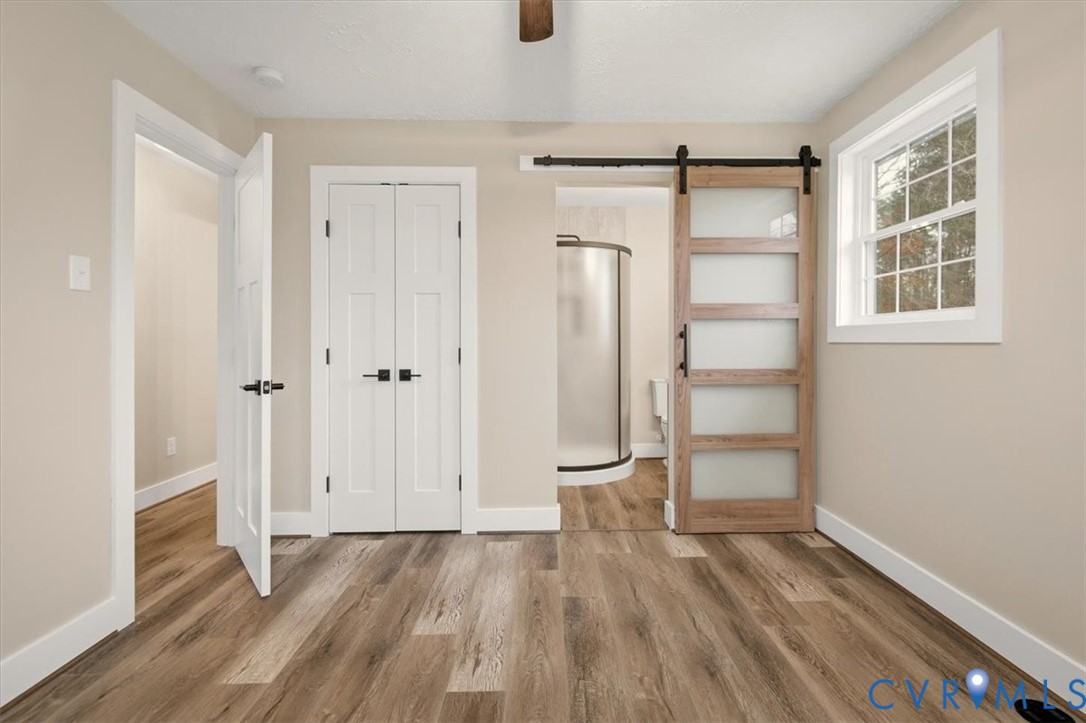 2495 Jackson Shop Road Goochland, VA 23063 - Photo 28 of 38 a view of empty room with wooden floor and window