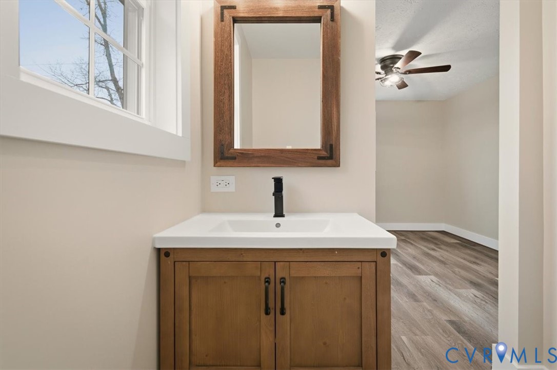 2495 Jackson Shop Road Goochland, VA 23063 - Photo 30 of 38 a bathroom with a sink and a mirror