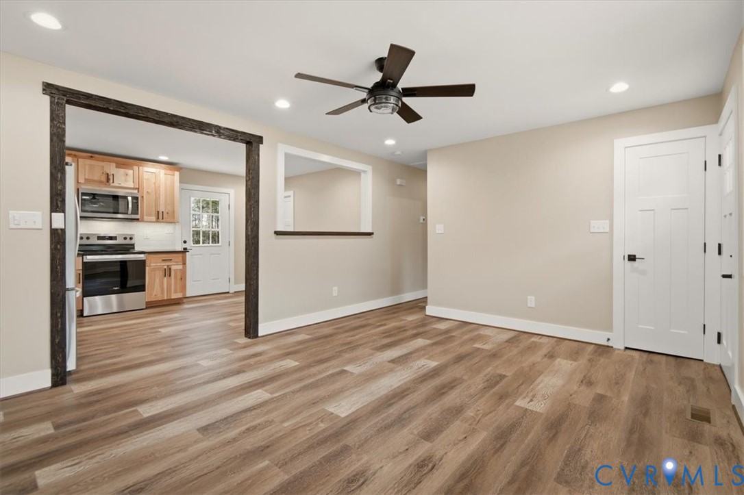 2495 Jackson Shop Road Goochland, VA 23063 - Photo 9 of 38 a view of livingroom with hardwood floor and a ceiling fan