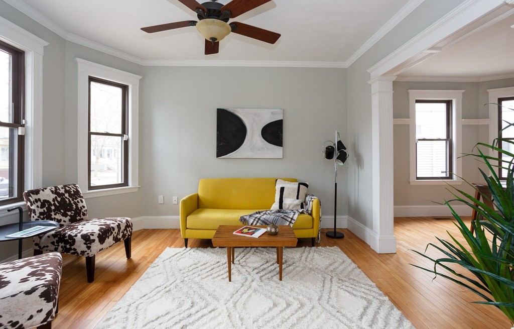 a living room with furniture and a window