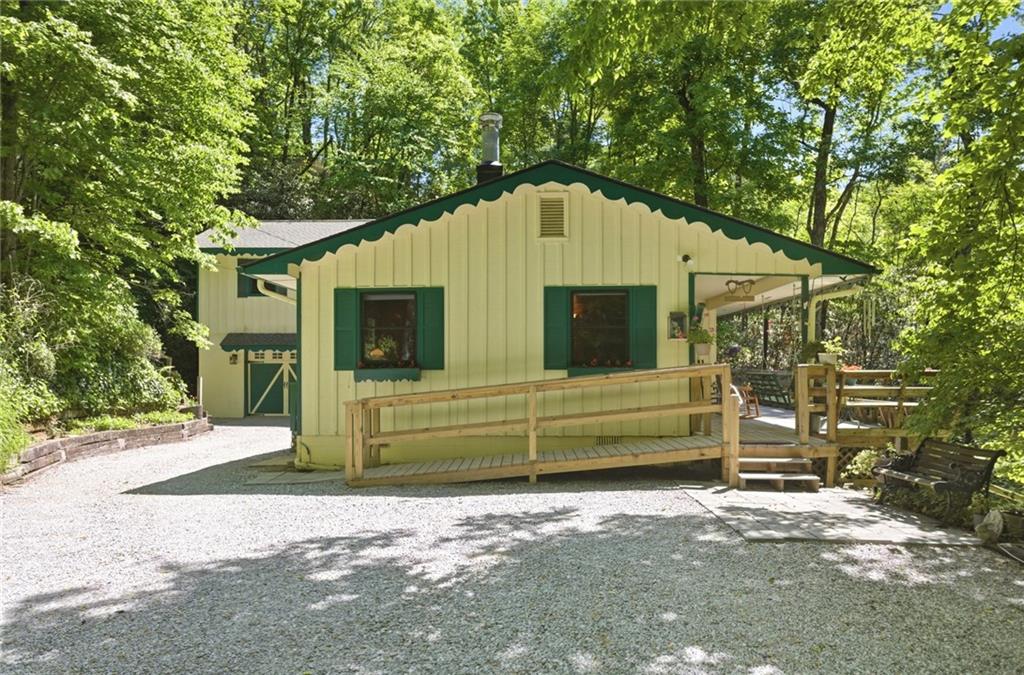 46 Spartan Lane Rabun Gap, GA 30568 - Photo 1 of 89 a front view of a house with a garden