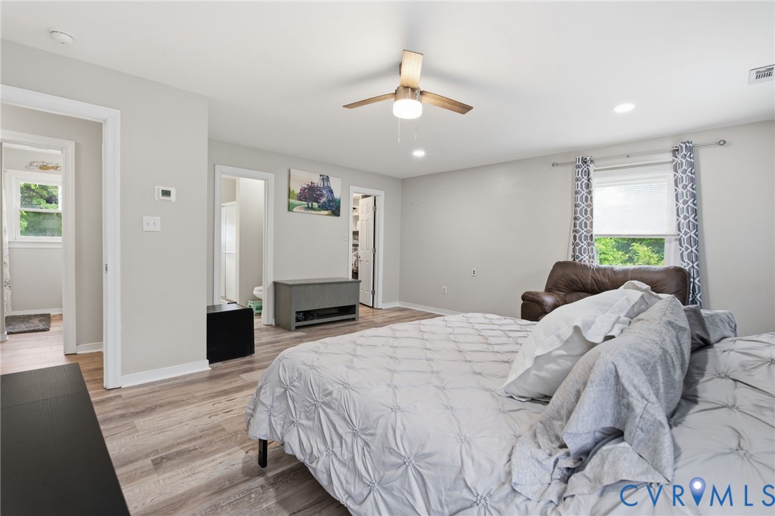 9110 Gayton Road Henrico, VA 23229 - Photo 24 of 54 a bed room with a bed and a chandelier