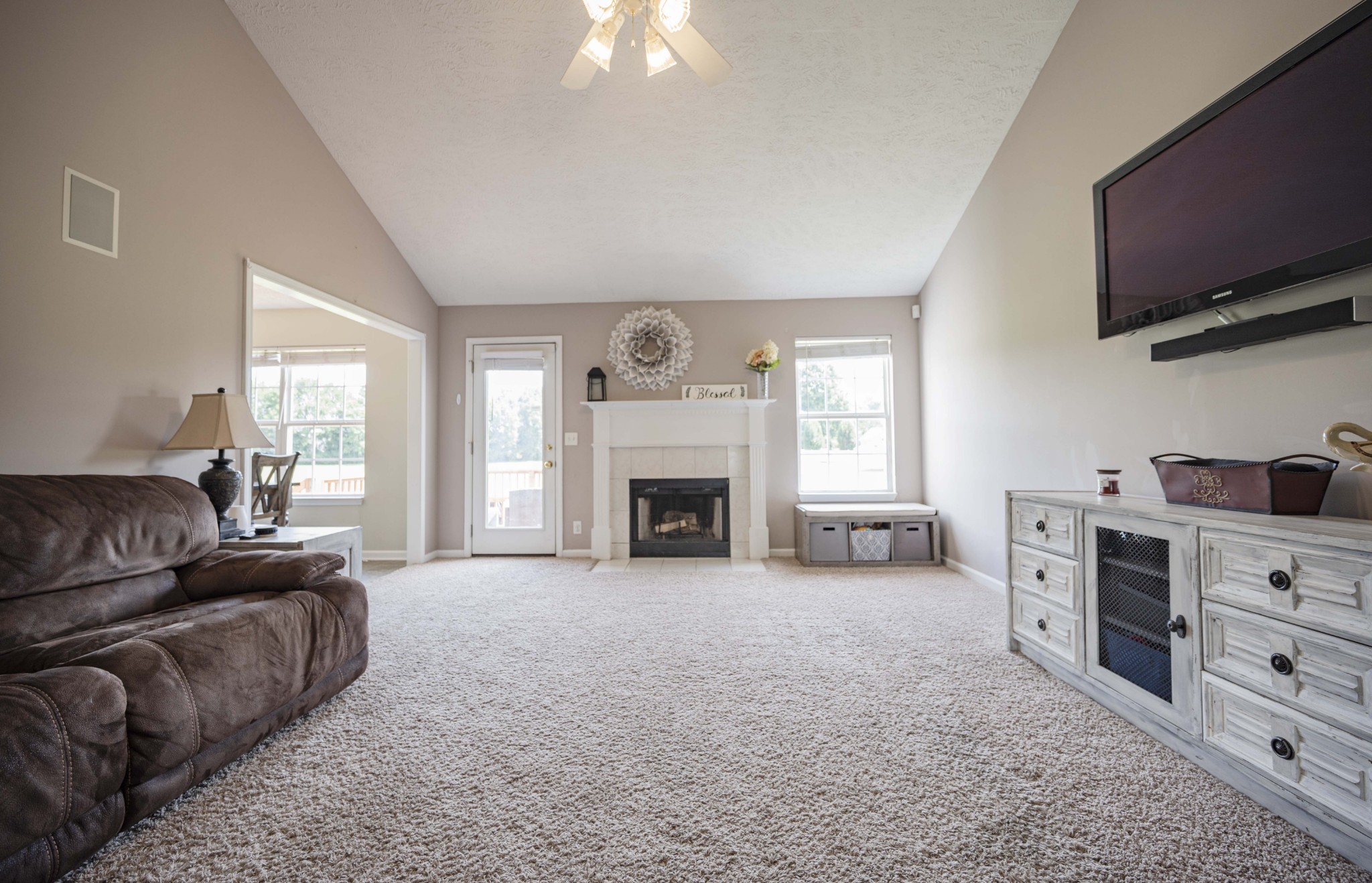 1237 Macduff Drive Murfreesboro, TN 37128 - Photo 2 of 20 a living room with furniture a fireplace and a flat screen tv