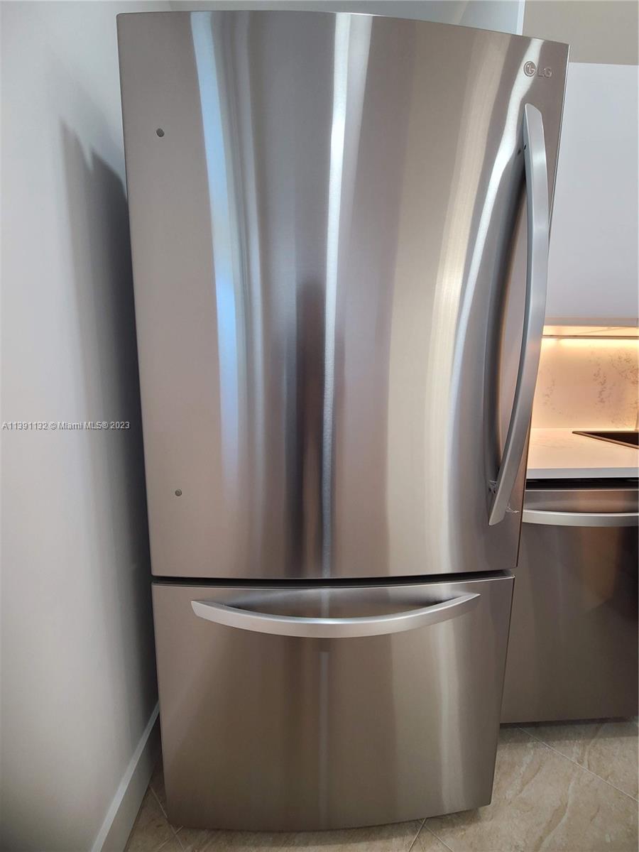 1612 Jefferson Avenue, Unit 403 Miami Beach, FL 33139 - Photo 13 of 55 a view of a refrigerator in a kitchen