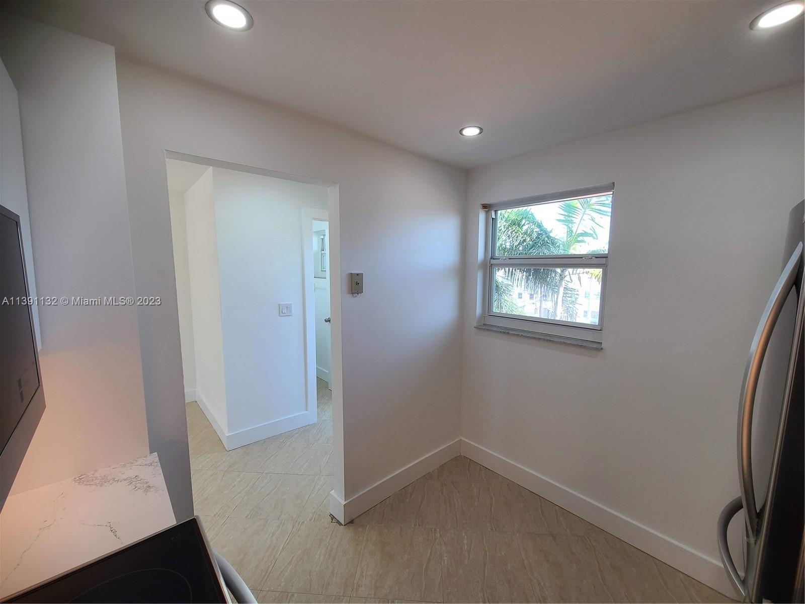 1612 Jefferson Avenue, Unit 403 Miami Beach, FL 33139 - Photo 16 of 55 an empty room with windows