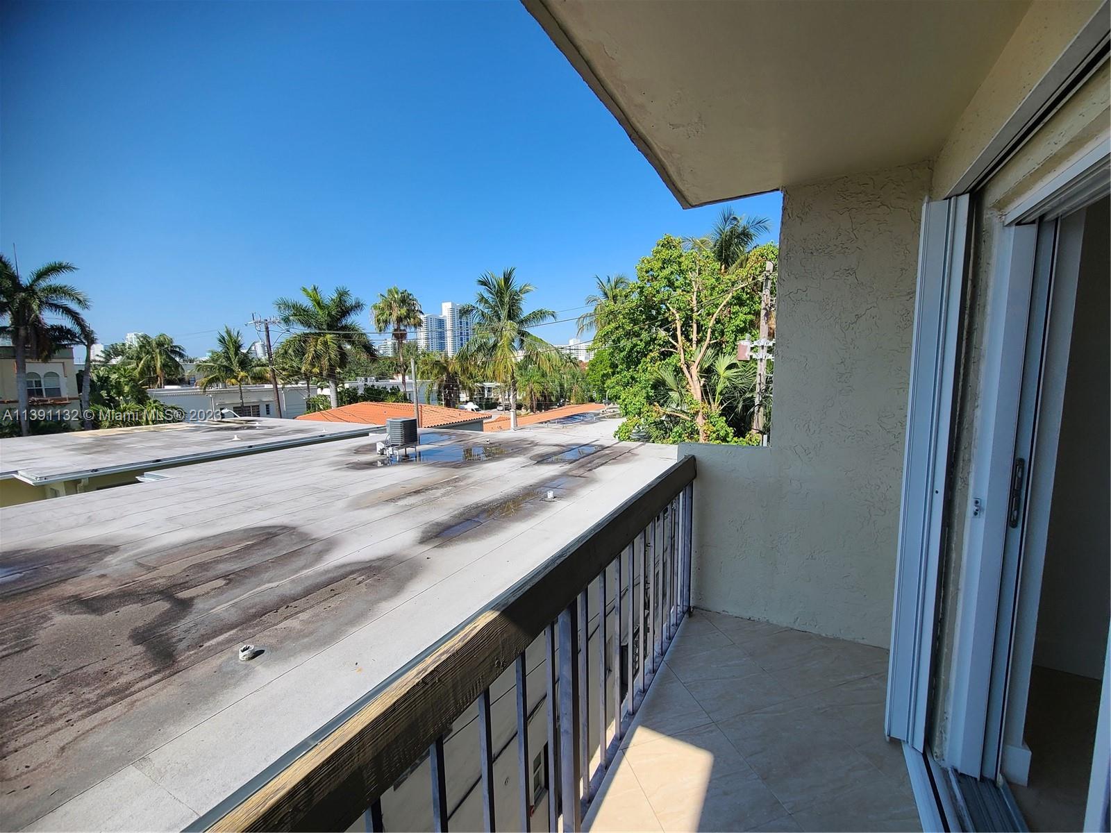 1612 Jefferson Avenue, Unit 403 Miami Beach, FL 33139 - Photo 20 of 55 a view of a balcony and cars park