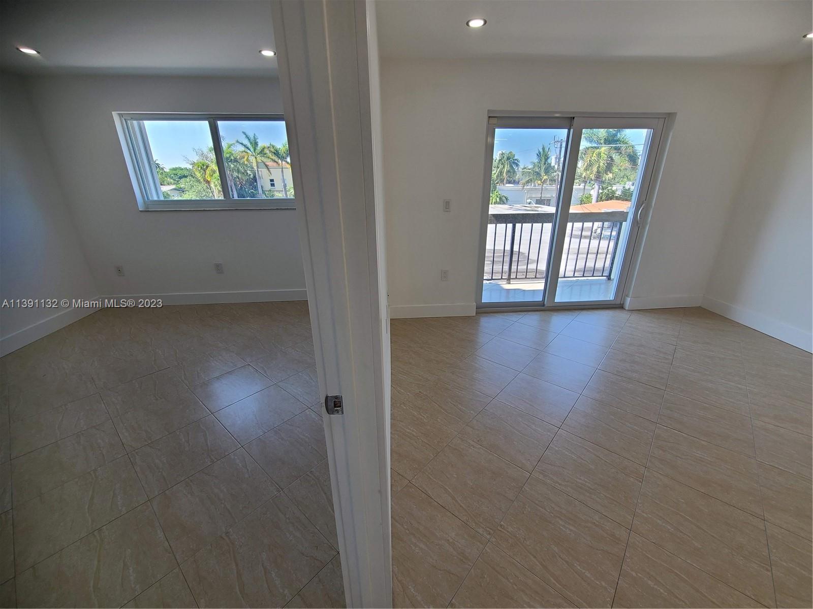1612 Jefferson Avenue, Unit 403 Miami Beach, FL 33139 - Photo 26 of 55 an empty room with wooden floor and windows