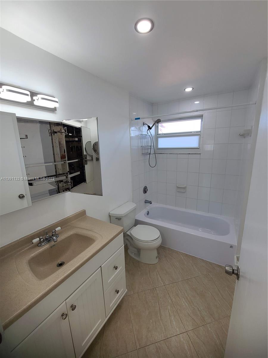1612 Jefferson Avenue, Unit 403 Miami Beach, FL 33139 - Photo 38 of 55 a bathroom with a sink a toilet and shower