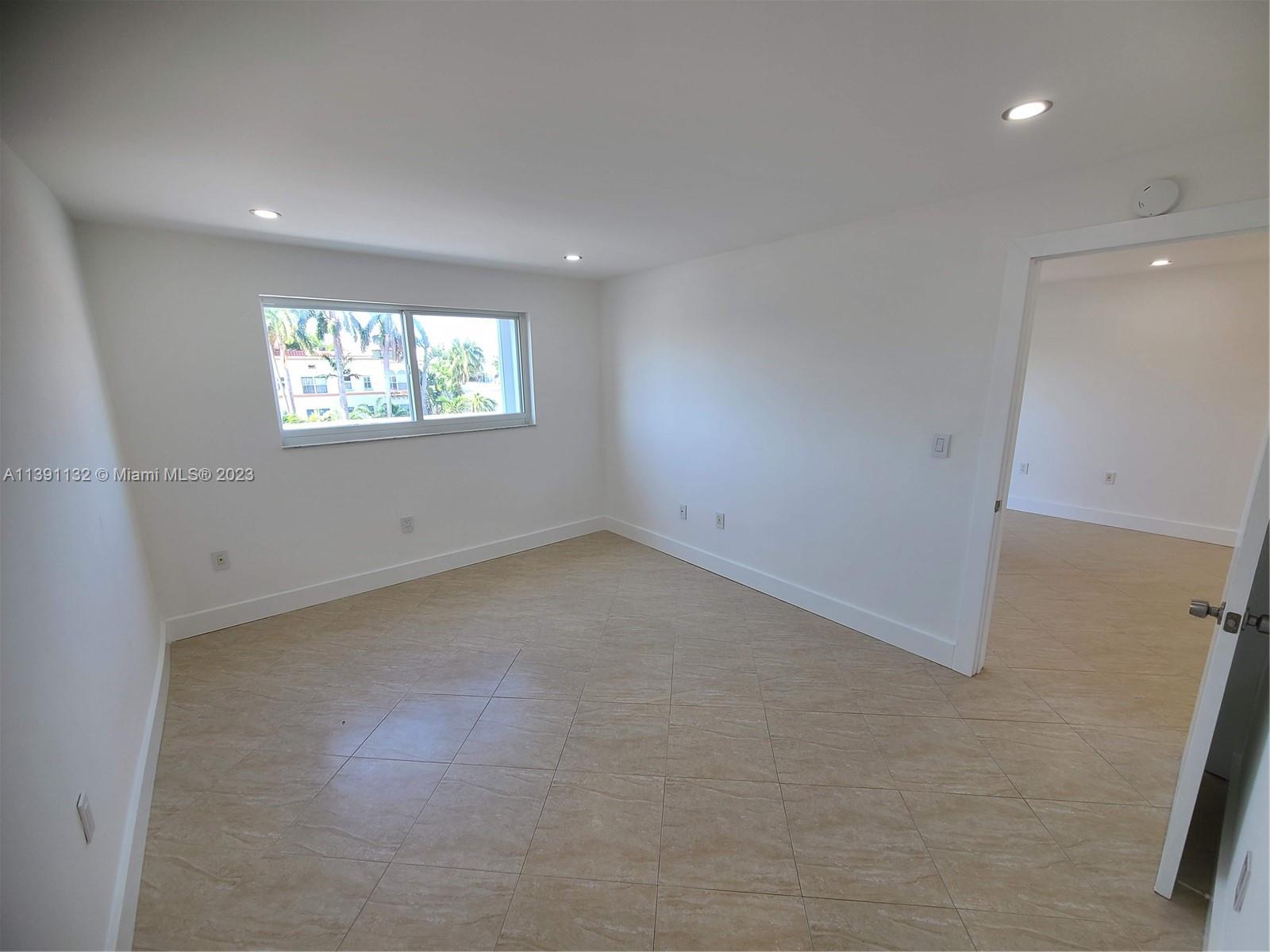 1612 Jefferson Avenue, Unit 403 Miami Beach, FL 33139 - Photo 41 of 55 an empty room with windows
