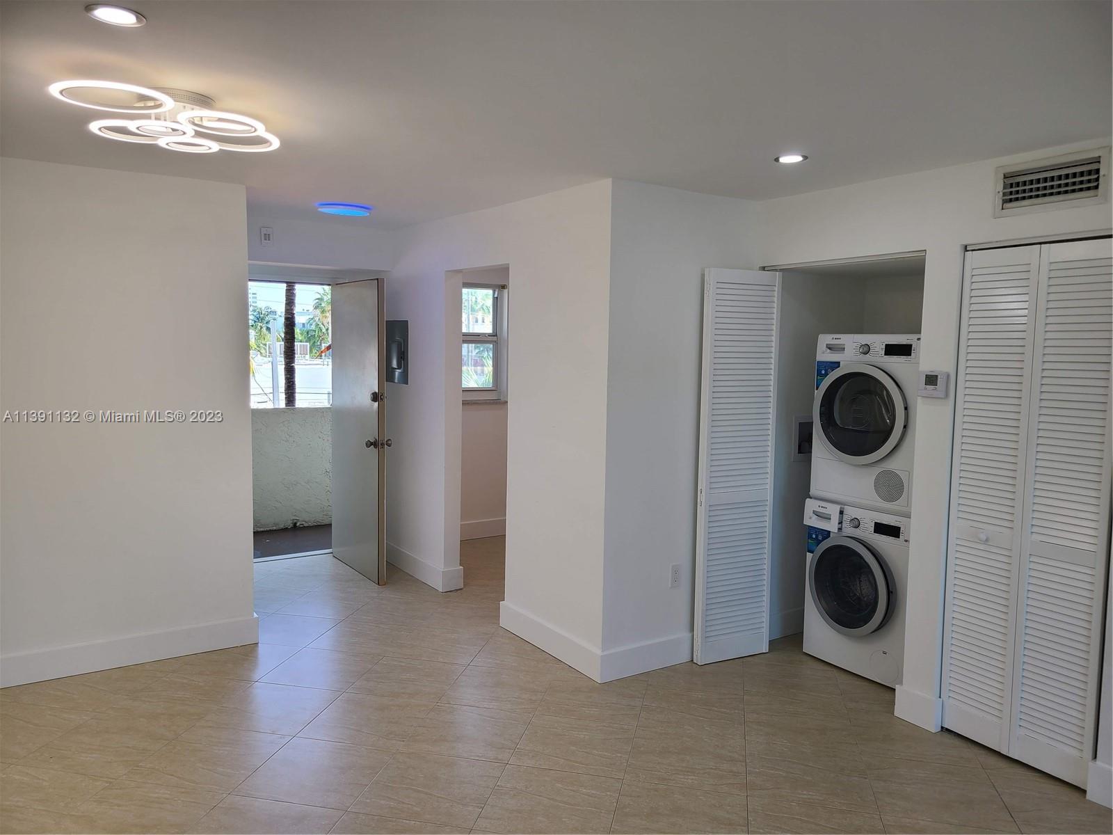 1612 Jefferson Avenue, Unit 403 Miami Beach, FL 33139 - Photo 43 of 55 a view of a hallway with washer and dryer