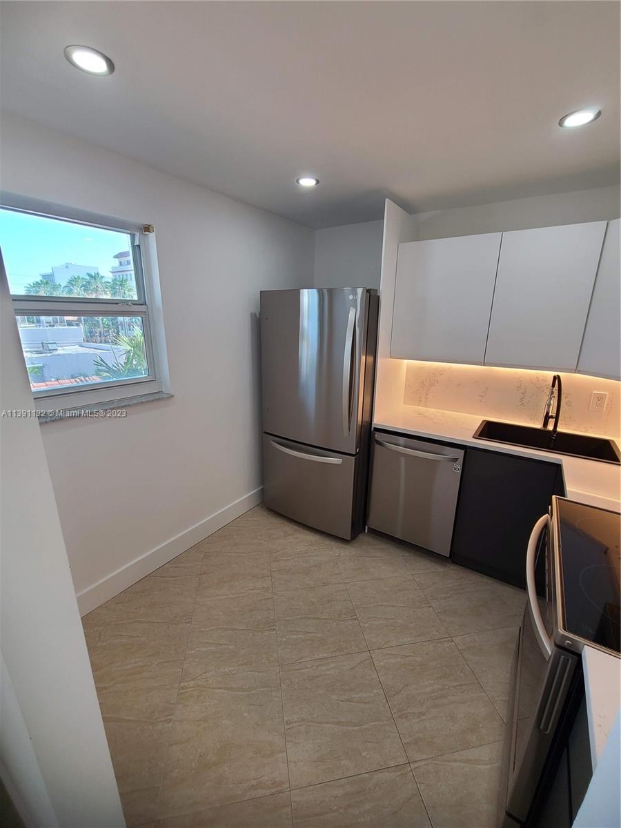1612 Jefferson Avenue, Unit 403 Miami Beach, FL 33139 - Photo 6 of 55 a view of a refrigerator in kitchen and window
