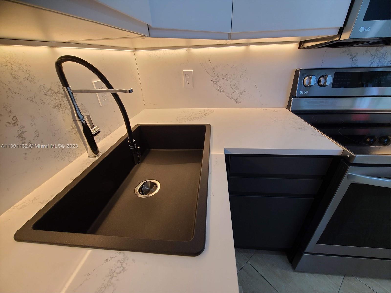 1612 Jefferson Avenue, Unit 403 Miami Beach, FL 33139 - Photo 7 of 55 a view of washer and dryer