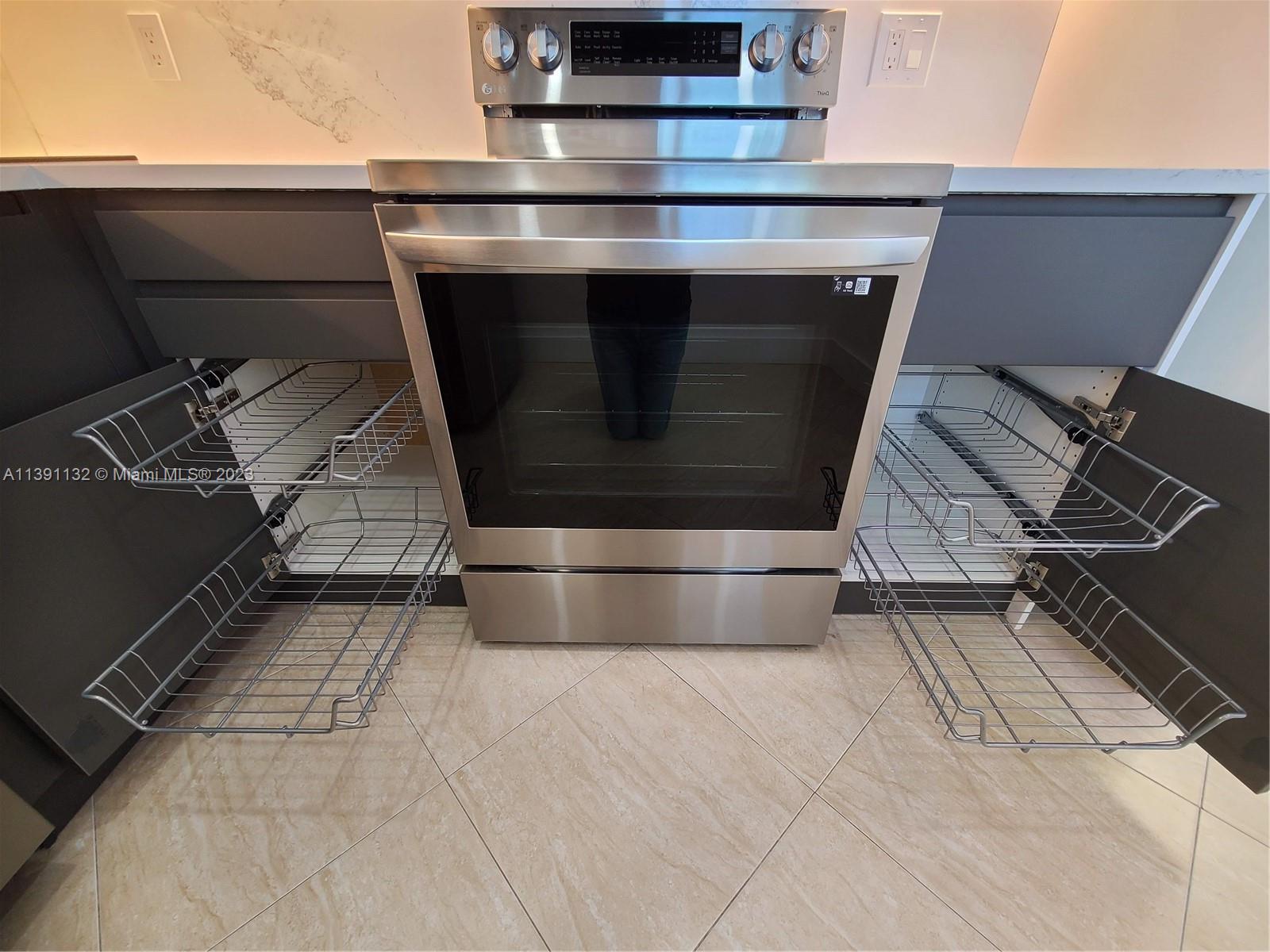 1612 Jefferson Avenue, Unit 403 Miami Beach, FL 33139 - Photo 8 of 55 a stove top oven sitting inside of a kitchen