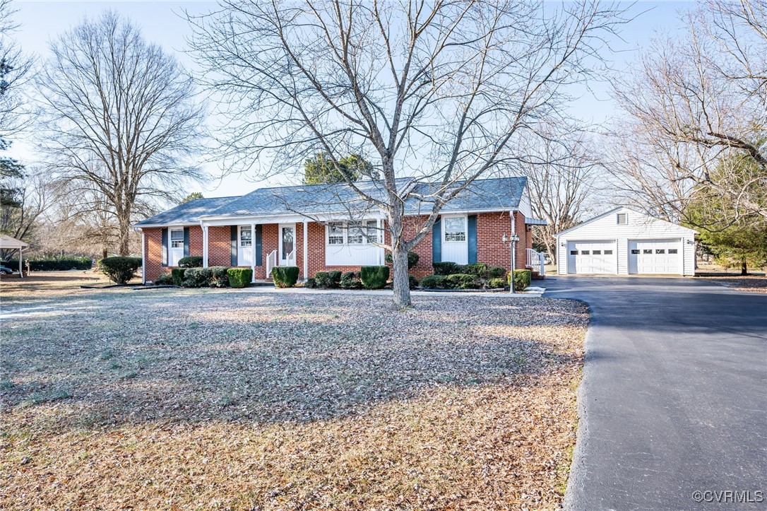 5810 Elko Road Sandston, VA 23150 - Photo 1 of 1 Single story home with an outbuilding and a garage