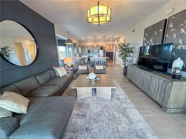 a spacious bedroom with a bed rug and window