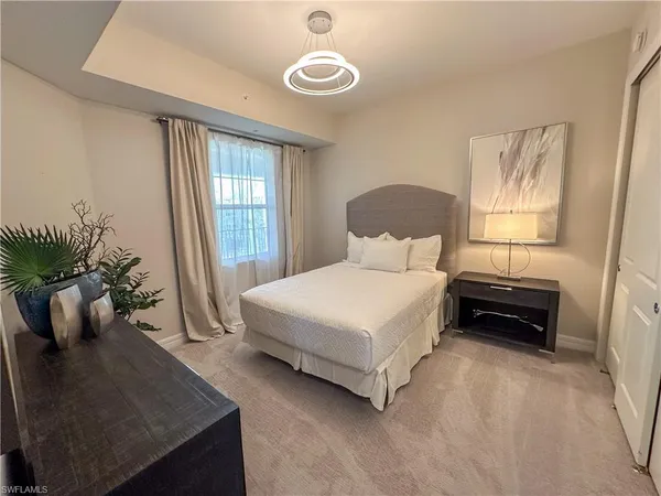 a bedroom with a bed and furniture