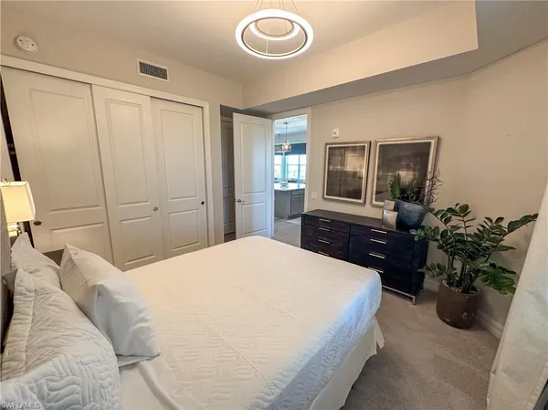 a hallway with front door wooden floor and window
