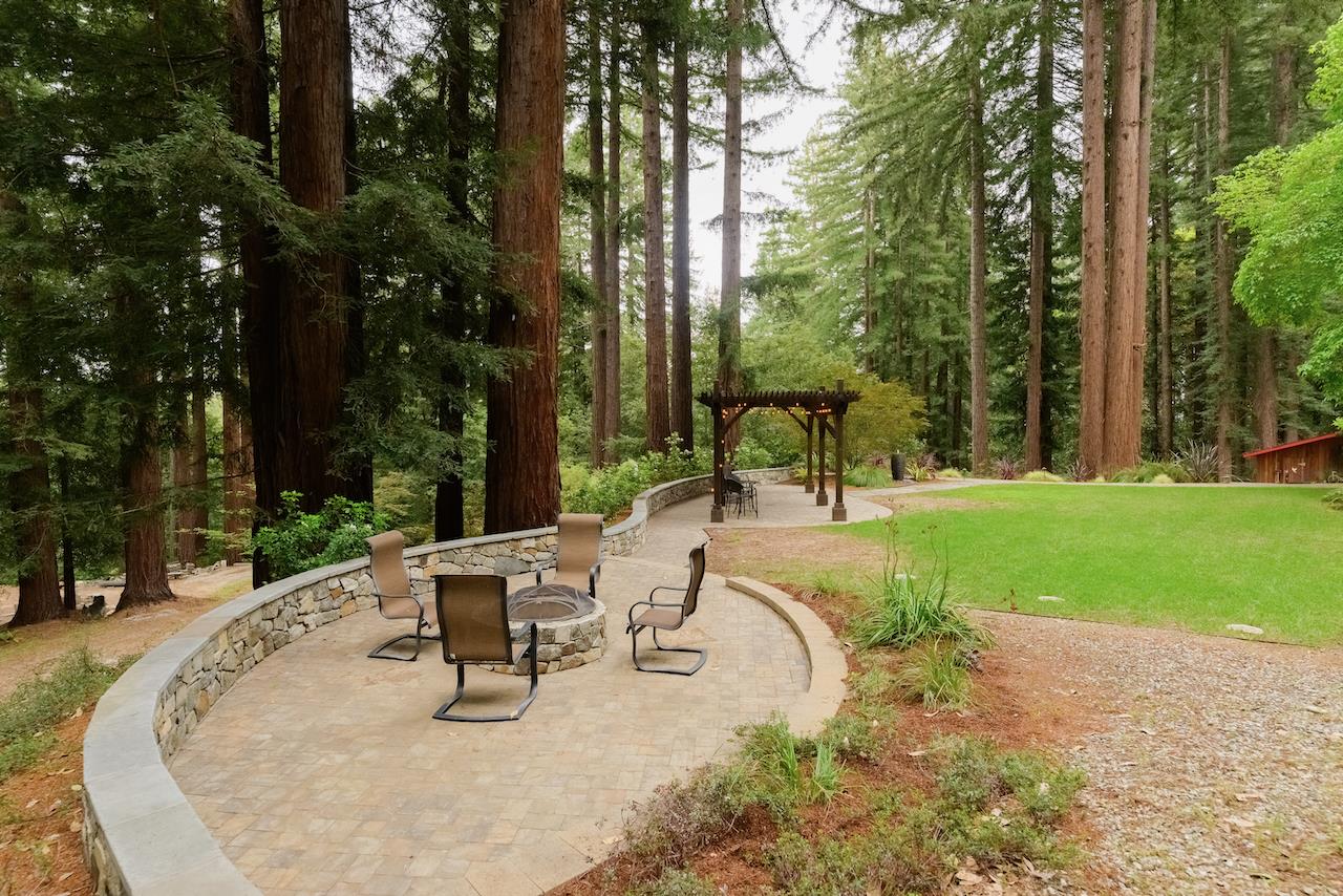 295 Jim's Road Ben Lomond, CA 95005 - Photo 7 of 139 a view of a swimming pool with a bench and trees