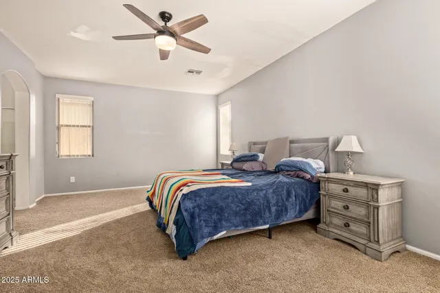 a bedroom with a bed and window