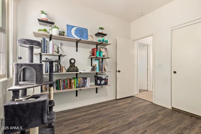 a view of living room with furniture and wooden floor