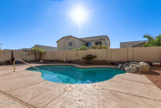 a view of a garden with a car parked in the background