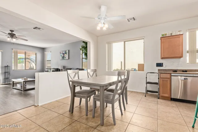 a dining room a kitchen island a stove a table and chairs