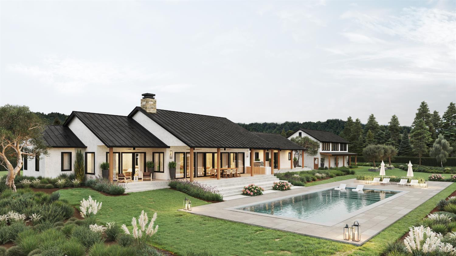 a aerial view of a house with swimming pool and a yard